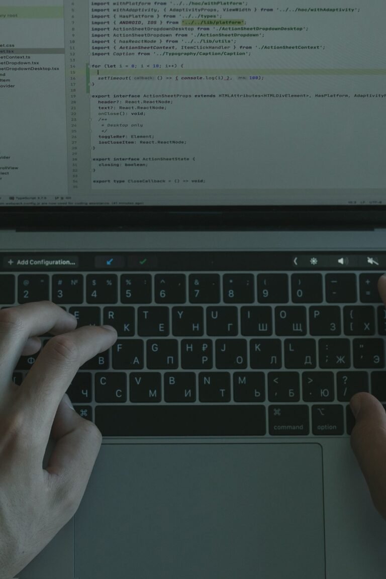 Laptop screen showing code for a website comparison