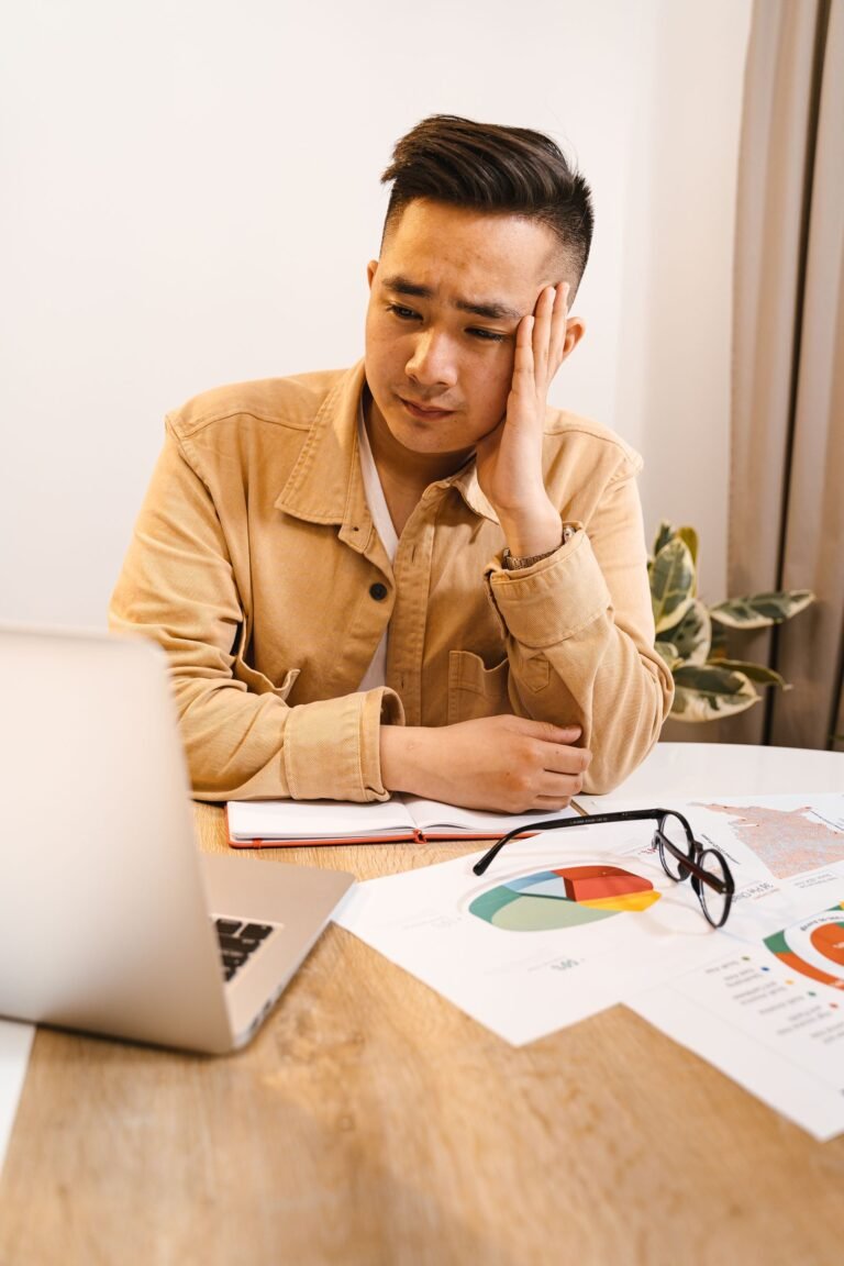 Frustrated person at a laptop dealing with a website error